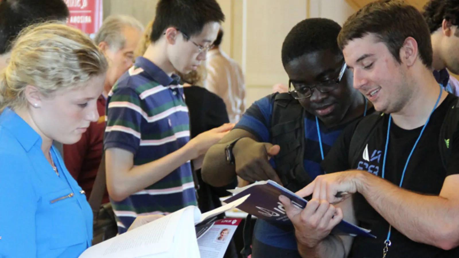 Photo of REU participants reviewing materials
